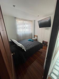 Postel nebo postele na pokoji v ubytování Apt est castellana cll 97