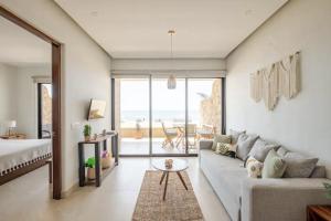 a living room with a couch and a table at Oceanfront condo with terrace in San Francisco +35 photos