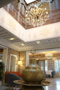 a large vase sitting on a table in a room at La Menara Hotel & SPA in Sidi Bou Saïd