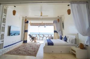 Postel nebo postele na pokoji v ubytování Royal Cliff Zanzibar