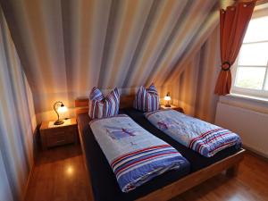 Postel nebo postele na pokoji v ubytování Ferienwohnung, Wieck am Darß