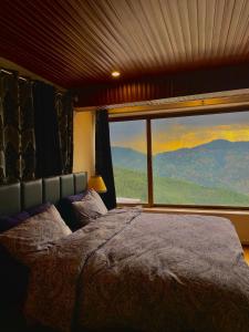 Ένα ή περισσότερα κρεβάτια σε δωμάτιο στο Sunset Villa