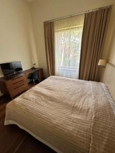 Ένα ή περισσότερα κρεβάτια σε δωμάτιο στο Jūros apartamentai 567