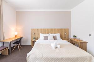 Posteľ alebo postele v izbe v ubytovaní Hotel Sněžné