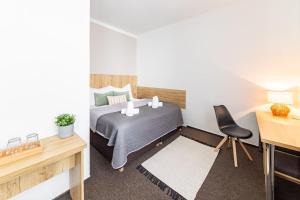 Posteľ alebo postele v izbe v ubytovaní Hotel Sněžné