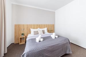 Posteľ alebo postele v izbe v ubytovaní Hotel Sněžné