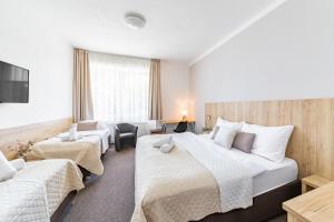 Posteľ alebo postele v izbe v ubytovaní Hotel Sněžné