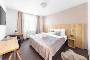 Posteľ alebo postele v izbe v ubytovaní Hotel Sněžné