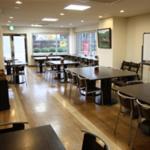 a dining room with tables and chairs in a restaurant at AZ Inn Higashi Omi Notogawa Ekimae in Higashiomi