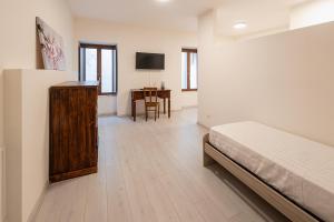 Postel nebo postele na pokoji v ubytování Albergo Diffuso Borgo La Terra