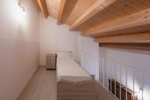 Postel nebo postele na pokoji v ubytování Albergo Diffuso Borgo La Terra
