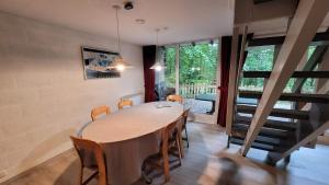 a dining room with a large table and chairs at Le Vieux Sart 1 in Stavelot