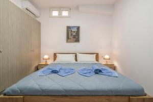 Ένα ή περισσότερα κρεβάτια σε δωμάτιο στο Manos Apartments