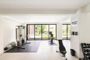 a gym with cardio equipment and a large window at Oceanfront condo with terrace in San Francisco