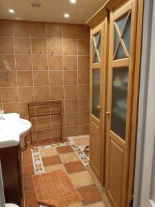 a bathroom with a shower with a toilet and a sink at maison du portail vieil in Vendres +35 photos