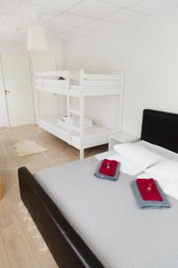 Postel nebo postele na pokoji v ubytování Konrad Family Guesthouse