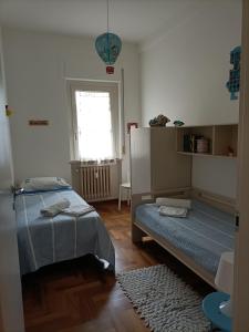 Posteľ alebo postele v izbe v ubytovaní Civico 96