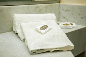 Rúm í herbergi á Stop Way Hotel São Luís