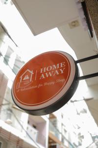 a sign hanging from the ceiling of a store at Home Away Ky Con - Serviced Apartment in Ho Chi Minh City +47 photos