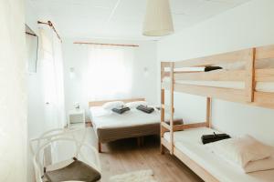 Ένα ή περισσότερα κρεβάτια σε δωμάτιο στο Konrad Family Guesthouse