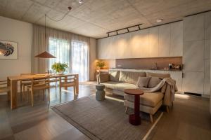 a living room with a couch and a table at 50 meters to the Sea in Juodkrantė