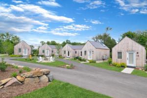 a row of wooden homes on a road at Bunkies- The Hold in Ottawa