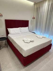 Un pat sau paturi într-o cameră la B&B Le Origini