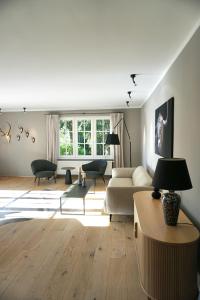 a living room with a couch and a table at Haus Gipfel-Glück in Goslar