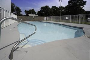 a large swimming pool with a metal hand rail at Hampton Inn Egg Harbor Township Atlantic City in Egg Harbor Township