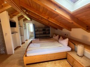 a bed in the attic of a room at Casa Valsugana Lagorai in Roncegno