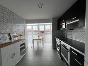 Kuchyň nebo kuchyňský kout v ubytování Coqueto apartamento junto al mar