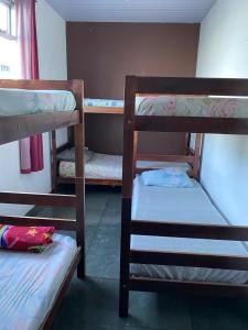 a group of bunk beds in a room at Hostel Alzira House Vidigal in Rio de Janeiro