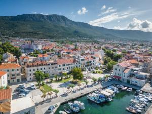 an aerial view of a city with boats in a harbor at Sea View Apartment No3 Kaštela in Kaštela