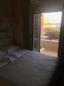 Postel nebo postele na pokoji v ubytování Apartments Rafailović Ljubo