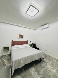 Ένα ή περισσότερα κρεβάτια σε δωμάτιο στο Dimora in pieno centro