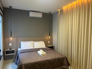 Postel nebo postele na pokoji v ubytování Pousada Rainha Dos Lagos