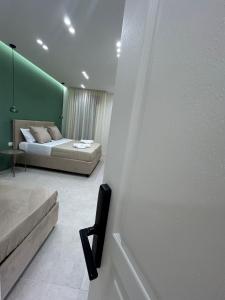 Un pat sau paturi într-o cameră la B&B Le Origini