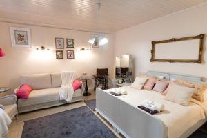a living room with a couch and a table at Ribizli Vintage Vendégház in Parád +39 photos
