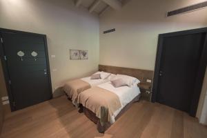 Agriturismo Locanda Del Pesco tesisinde bir odada yatak veya yataklar