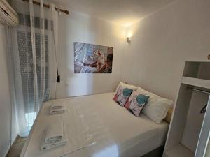 A bed or beds in a room at Corfu Glyfada Beach Apartment 13
