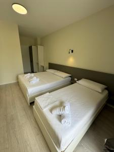 Postel nebo postele na pokoji v ubytování Meraki Hotel