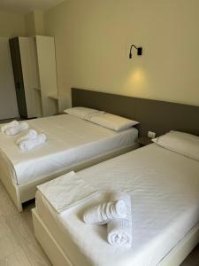 Postel nebo postele na pokoji v ubytování Meraki Hotel