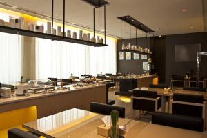 Restaurace v ubytování Jinjiang Inn Fuzhou Cangshan Olympic Centre + 21 fotografií