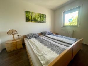 Ένα ή περισσότερα κρεβάτια σε δωμάτιο στο Wunderschönes Apartment in der Goldstadt Pforzheim