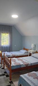 Postel nebo postele na pokoji v ubytování Apartmani Romansa Perucac