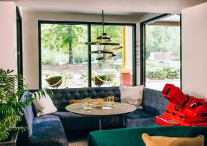a living room with a couch and a table at All-Movie Hotel in Peachtree City