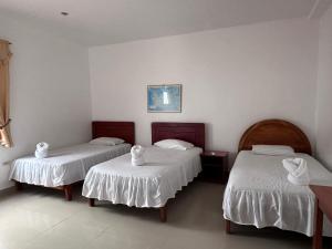Voodi või voodid majutusasutuse Hostal Insular toas