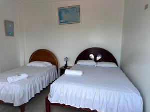 Voodi või voodid majutusasutuse Hostal Insular toas