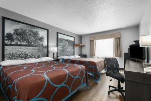 Letto o letti in una camera di Super 8 by Wyndham Grapevine/DFW Airport Northwest