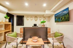 a living room with a large flat screen tv at Elephant In The Room in Istanbul